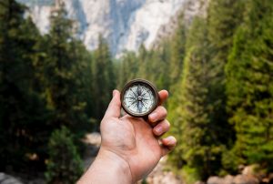 Reading a compass is one of the survival skills every hiker should have for hiking