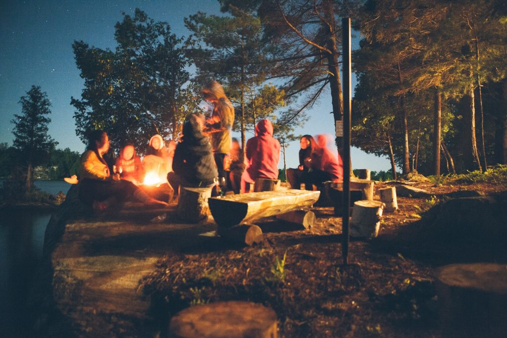 First-time campers enjoying a fire