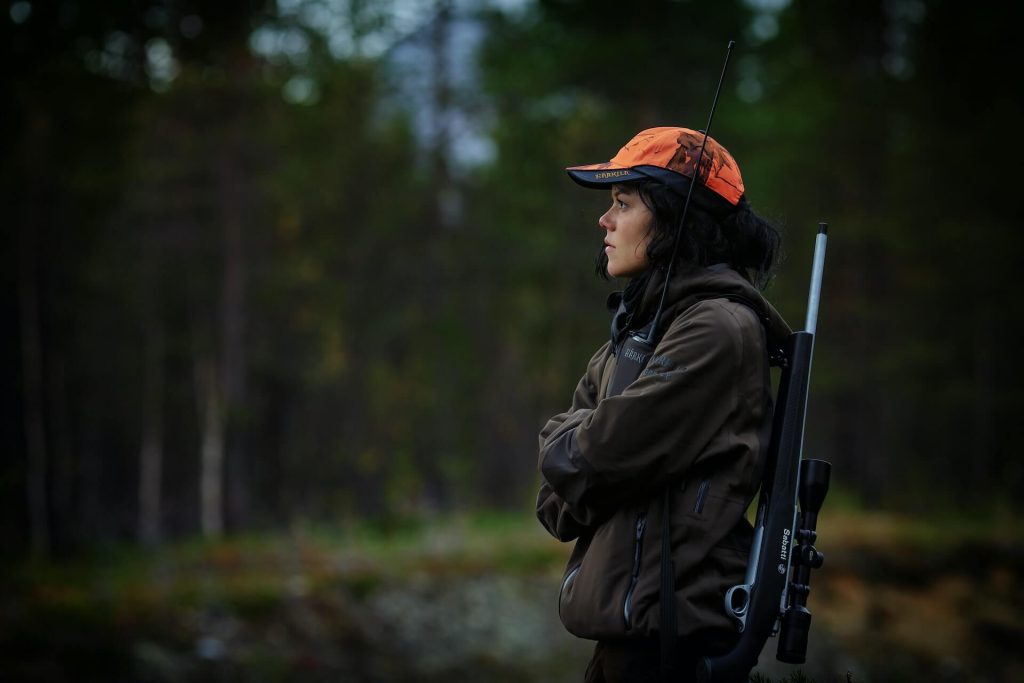 A female hunter with her rifle